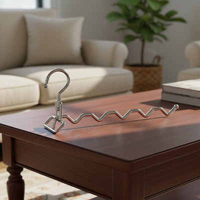 cintre metallique pliant inox sur table