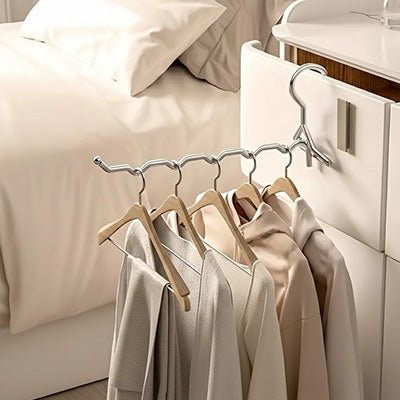 cintre metallique pliant inox tiroir vêtements clairs
