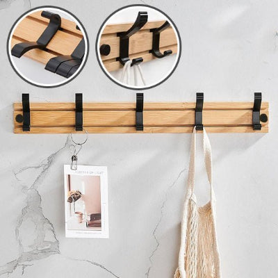 porte manteau mural base bois cinq crochets noirs deux details mur blanc