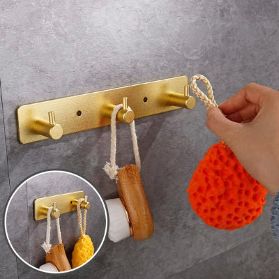 porte manteau mural dore trois crochets un detail