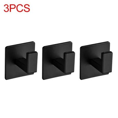 trois crochets muraux minimaliste noirs fond blanc